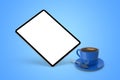 Floating tablet mockup and coffee cup on the blue isolated background