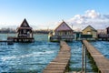 floating village bungalows in Bokod Hungary wit wooden pier walkway
