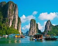 Floating village and rock islands in Halong Bay Royalty Free Stock Photo