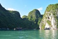 Floating village and rock islands in Halong Bay, Vietnam, Southeast Asia. Travel destination and natural background Royalty Free Stock Photo