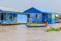 Floating village on the Tonle Sap Lake in Cambodia and two boys Royalty Free Stock Photo