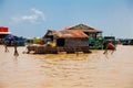 The floating village on the water (komprongpok) of Tonle Sap lake. Cambodia. Royalty Free Stock Photo