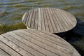 Floating walkway made of wooden planks. narrow curved paths on stilts driven into the bottom, above the lake water. has no railing Royalty Free Stock Photo