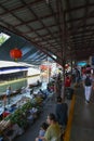 Floating water market in Ratchaburi, Thailand selling fruit and vegetables from their boats.