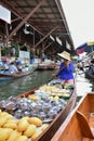 Floating water market in Ratchaburi, Thailand selling fruit and vegetables from their boats.