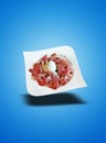 Floating White plate with ham and burata cheese on blue gradient Royalty Free Stock Photo