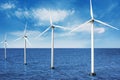 Floating wind turbines in sea under blue sky. Alternative energy source