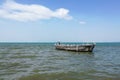 A flock of bird on very old fishing boat in the sea