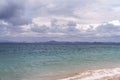 A Flock Of Birds Against A Stormy Sky Above A Tropical Island Royalty Free Stock Photo