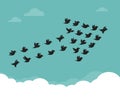 Flock of birds flying in the sky in an arrow Royalty Free Stock Photo