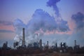 Flock of Birds Flying By Smoke Stacks Royalty Free Stock Photo