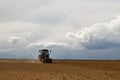 Flock of birds in rice fields and a tractor cultivating rice field , farmer`s rice field Royalty Free Stock Photo