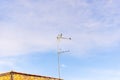 Flock of birds on a TV antenna against stunning blue sky in Valenca, Bahia