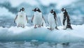 Flock of four lovely penguins floating on small iceberg in cold Antarctic sea waters with picturesque moody landscape background.