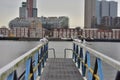 A flock of gulls on the rails of the pier on a cloudy day Royalty Free Stock Photo