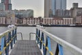 A flock of gulls on the rails of the pier on a cloudy day Royalty Free Stock Photo