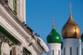 A flock of pigeons sits in the cold in winter on the window next to the golden domes of the church Royalty Free Stock Photo