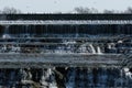 Flock of Ring-billed Gulls gathered over waterfall on spillway Royalty Free Stock Photo