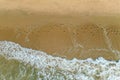 a flock of white small birds on the seashore on the sand view fron top drone in Goa Royalty Free Stock Photo