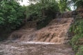 Flood, cataclysm, high rainfall, the threat of flooding, dirty water. Dzhurinsky waterfall, Ukraine