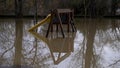 flood, children\'s swing is flooded with water.