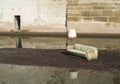 Flood desaster with furniture on an island in the water Royalty Free Stock Photo