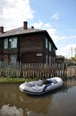 Flood. The river Ob, which emerged from the shores, flooded the outskirts of the city.Boats near the houses of residents