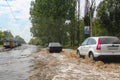 Flood. Road and cars under water. Heavy rain and downpour flooded city streets with water. strong deluge. Natural anomaly. Bad