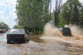 Flood. Road and cars under water. Heavy rain and downpour flooded city streets with water. strong deluge. Natural anomaly. Bad