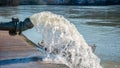 Flood water being pumped from pump station Royalty Free Stock Photo