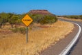 Flood way street sign besides road in Australian bush Royalty Free Stock Photo