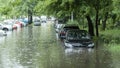 Flooded cars on the street of the city. Street after heavy rain. Water could enter the engine, transmission parts or other places