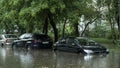 Flooded cars on the street of the city. Street after heavy rain. Water could enter the engine, transmission parts or other places