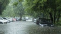 Flooded cars on the street of the city. Street after heavy rain. Water could enter the engine, transmission parts or other places