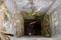 Flooded disguised secret military bunker. Abandoned bomb shelter