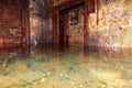 Flooded disguised secret military bunker. Abandoned bomb shelter