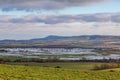 Looking out towards Firle Beacon from the South Downs near Lewes, with flooded fields at Iford inbetween