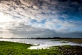 Flooded fenland and stormy sky Royalty Free Stock Photo