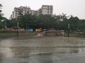 Flooded, heavy rains shopping area street day