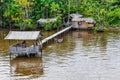 Flooded house and a family on the Amazon River, Brazil Royalty Free Stock Photo