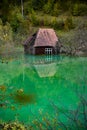 Flooded house isolated in the lake , dead forest after mining poisoning waste lake