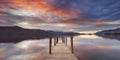 Flooded jetty in Lake District, England at sunset Royalty Free Stock Photo