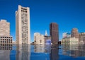 Flooded modern high rise buildings reflecting in the water. Climate change