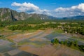 Flooded rice paddies and limestone cliffs in Laos Royalty Free Stock Photo