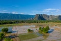 Flooded rice paddies with limestone cliffs in Laos Royalty Free Stock Photo