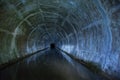 Flooded round sewer tunnel is reflecting in water