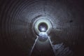 Flooded round underground drainage sewer tunnel with dirty sewage water Royalty Free Stock Photo