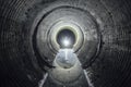 Flooded round underground drainage sewer tunnel with dirty sewage water Royalty Free Stock Photo