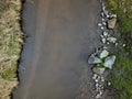 flooded stream led to a narrow riverbed where the water drains quickly Royalty Free Stock Photo