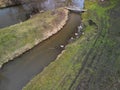 flooded stream led to a narrow riverbed where the water drains quickly Royalty Free Stock Photo